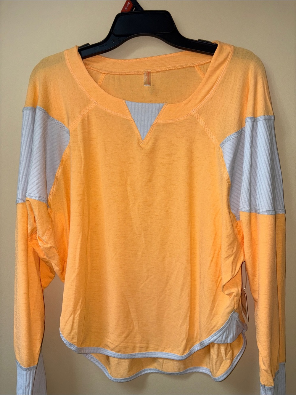 Light Orange Long-Sleeve Women's Top with White Accents